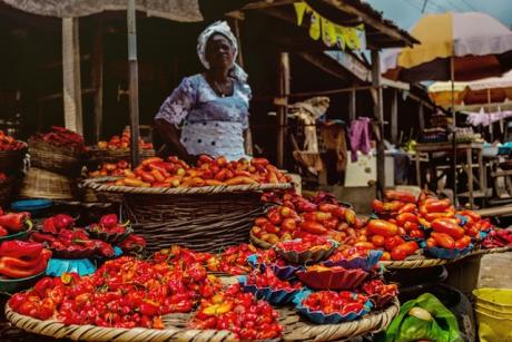 Lady selling chillies in a market in Lagos, Nigeria