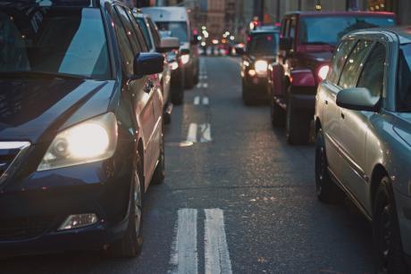 Row of car headlights in rush hour traffic