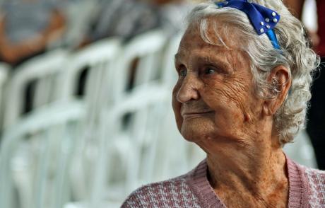 An elderly woman waiting in a hospital